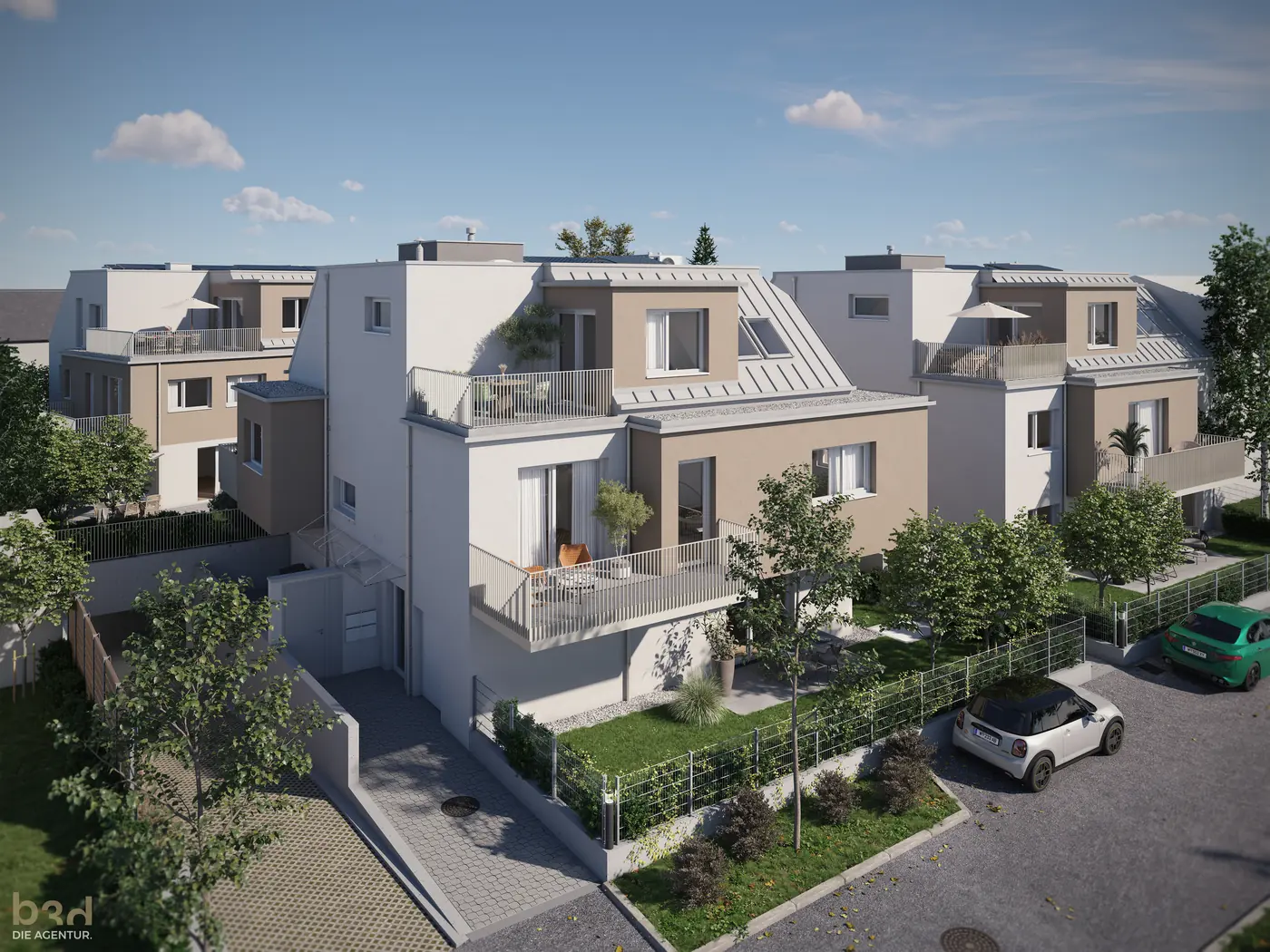 Blick über das Ensemble mit Dachterrassen und Tiefgaragenzufahrt